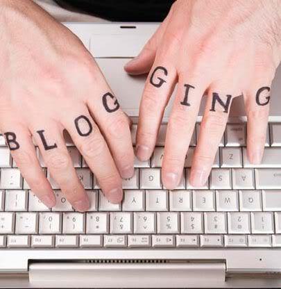 Fingers type on keyboard with the letters blogging on each finger