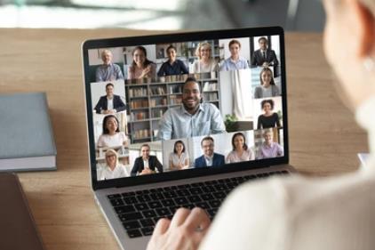 Image of women connecting with other people via here laptop.